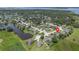 Aerial view of the community, showcasing homes, landscaping, and water features at 1525 Gants Cir, Kissimmee, FL 34744