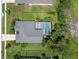 Aerial view of the home, highlighting the backyard pool, landscaping, and roof at 1525 Gants Cir, Kissimmee, FL 34744