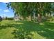 Spacious backyard showcasing a large grassy area, offering ample space for recreation and relaxation at 1525 Gants Cir, Kissimmee, FL 34744
