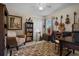 Cozy bedroom with neutral walls and decor, and several stringed instruments hanging on the wall at 1525 Gants Cir, Kissimmee, FL 34744