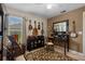 Bedroom features an ornate mirror above a small desk, and stringed instruments on the wall at 1525 Gants Cir, Kissimmee, FL 34744
