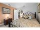 Charming bedroom features hardwood floors, side table, natural light from the windows, and antique decor at 1525 Gants Cir, Kissimmee, FL 34744