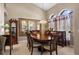 Dining area featuring large windows, a dining table, and elegant accents at 1525 Gants Cir, Kissimmee, FL 34744