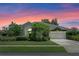 Charming home with lush landscaping and a two-car garage at 1525 Gants Cir, Kissimmee, FL 34744
