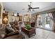 Spacious living room featuring tile flooring, ceiling fan, and comfortable seating at 1525 Gants Cir, Kissimmee, FL 34744