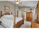 Comfortable main bedroom features neutral walls and a matching wood bedroom set, with ample storage and natural light at 1525 Gants Cir, Kissimmee, FL 34744