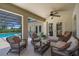 Spacious covered patio features comfortable seating and views of the pool area at 1525 Gants Cir, Kissimmee, FL 34744