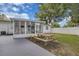 Home exterior and backyard features a picnic table and access to the screened in patio at 1710 Thor Ave, Apopka, FL 32703