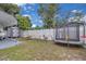 Large backyard featuring a swing set and a trampoline that is perfect for outdoor fun at 1710 Thor Ave, Apopka, FL 32703