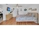 Well-lit bedroom features a ceiling fan, decor, and a TV for comfort and entertainment at 1710 Thor Ave, Apopka, FL 32703