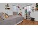 Cozy bedroom featuring a plush bed, toy storage, and natural light at 1710 Thor Ave, Apopka, FL 32703