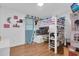 Fun bedroom featuring a loft bed with workspace, decor, and natural light at 1710 Thor Ave, Apopka, FL 32703
