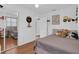 Comfortable bedroom featuring natural light, built-in storage, and mirror at 1710 Thor Ave, Apopka, FL 32703