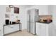 Modern kitchen featuring stainless steel appliances, granite countertops, and stylish decorative accents at 1710 Thor Ave, Apopka, FL 32703