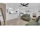 A view of the living room, dining area and kitchen in a well-lit and decorated living space at 1710 Thor Ave, Apopka, FL 32703