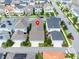 Aerial perspective of a residential area with various home styles and neatly manicured lawns at 1855 Treasure Cv, Kissimmee, FL 34747