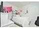 Bright bedroom filled with wall decorations, and a comfortable bed at 1855 Treasure Cv, Kissimmee, FL 34747