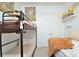 A shared bedroom with a bunk bed and double bed featuring neutral colors at 1855 Treasure Cv, Kissimmee, FL 34747