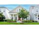 Inviting curb appeal with a charming front porch, rocking chairs, and lush landscaping at 1855 Treasure Cv, Kissimmee, FL 34747