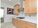 Close-up of the kitchen, featuring stainless appliances, gas range, and light wood cabinetry at 1855 Treasure Cv, Kissimmee, FL 34747