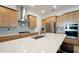Well-equipped kitchen featuring stainless appliances, an island with seating and plenty of storage space at 1855 Treasure Cv, Kissimmee, FL 34747