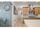 Bright kitchen with stainless steel hood vent, gas cooktop, and access to the patio at 1855 Treasure Cv, Kissimmee, FL 34747