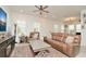 Inviting living room with hardwood floors, a large coffee table, and comfortable seating at 1855 Treasure Cv, Kissimmee, FL 34747
