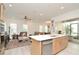 Open floor plan showcasing the kitchen flowing into the living room with a comfortable seating area at 1855 Treasure Cv, Kissimmee, FL 34747