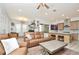 Open-concept living area showcases modern furnishings and an adjacent kitchen at 1855 Treasure Cv, Kissimmee, FL 34747