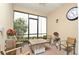 Enclosed patio with brick flooring, outdoor seating, and a view of the greenery at 1855 Treasure Cv, Kissimmee, FL 34747