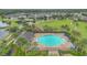 Aerial view of community pool area and amenities with lush landscaping, perfect for Gathering recreation and relaxation at 1864 Castleton Dr, St Cloud, FL 34771