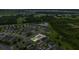 An aerial view of a single Gathering home in a neighborhood with a lush green landscape and ponds at 1864 Castleton Dr, St Cloud, FL 34771