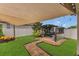 Enjoy this backyard with a grilling area, canopy, beautiful lawn and paver walkways at 1864 Castleton Dr, St Cloud, FL 34771