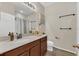 Well-lit bathroom with a modern vanity, large mirror, and ample storage for a clean, functional space at 1864 Castleton Dr, St Cloud, FL 34771