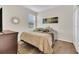 Comfortable bedroom with neutral walls, a window providing natural light, and laminate flooring at 1864 Castleton Dr, St Cloud, FL 34771