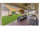 Relaxing covered patio features ample seating with ceiling fans and views of the spacious backyard at 1864 Castleton Dr, St Cloud, FL 34771