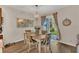 Cozy dining area with natural light, a chandelier, and a view of the backyard through sliding glass doors at 1864 Castleton Dr, St Cloud, FL 34771