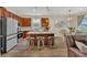 Modern kitchen with stainless steel appliances, a center island with bar stool seating, and pendant lighting at 1864 Castleton Dr, St Cloud, FL 34771