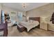 This main bedroom has a decorative brick accent wall and luxury vinyl plank flooring at 1864 Castleton Dr, St Cloud, FL 34771