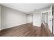Bedroom with hardwood floors, a closet, and access to a hallway at 1891 Caralee Blvd # 3, Orlando, FL 32822