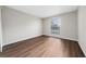 A sunlit bedroom with modern flooring and neutral wall paint at 1891 Caralee Blvd # 3, Orlando, FL 32822