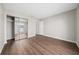 A bright bedroom features a mirrored closet and hardwood flooring at 1891 Caralee Blvd # 3, Orlando, FL 32822