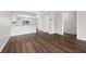 Open concept living space featuring laminate floors, fresh paint and neutral colors at 1891 Caralee Blvd # 3, Orlando, FL 32822