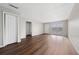 Living room with a large window and laminate floors at 1891 Caralee Blvd # 3, Orlando, FL 32822