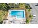 Aerial view of the rectangular community pool surrounded by palm trees at 1891 Caralee Blvd # 3, Orlando, FL 32822