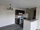 Eat-in kitchen with modern countertops, dark wood cabinets, breakfast bar, and white appliances at 2030 Cascades Blvd # 204, Kissimmee, FL 34741