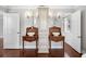 Elegant bathroom features a double sink vanity with two mirrors and dark hardwood floors at 205 N Village St, Celebration, FL 34747
