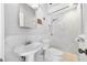 Elegant bathroom with white marble walls, modern fixtures, and glass-enclosed shower at 205 N Village St, Celebration, FL 34747