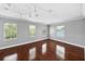 Spacious bedroom with hardwood floors, multiple windows and modern track lighting at 205 N Village St, Celebration, FL 34747