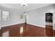 Bright bedroom with hardwood floors, neutral walls, and a view of the garden through a window, creating a peaceful retreat at 205 N Village St, Celebration, FL 34747